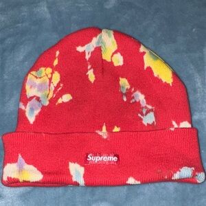 Supreme Splatter Dyed Beanie in a bright red colorway.